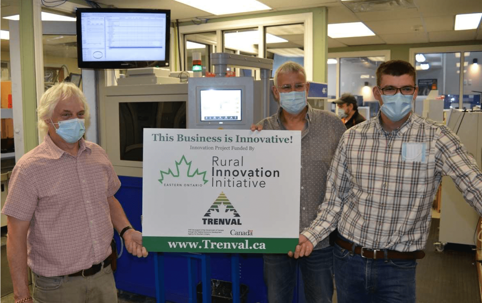 Harry Todd of Trenval (left) presents Tom Aquino (centre) and Kyle Aquino (right) with RIIEO award